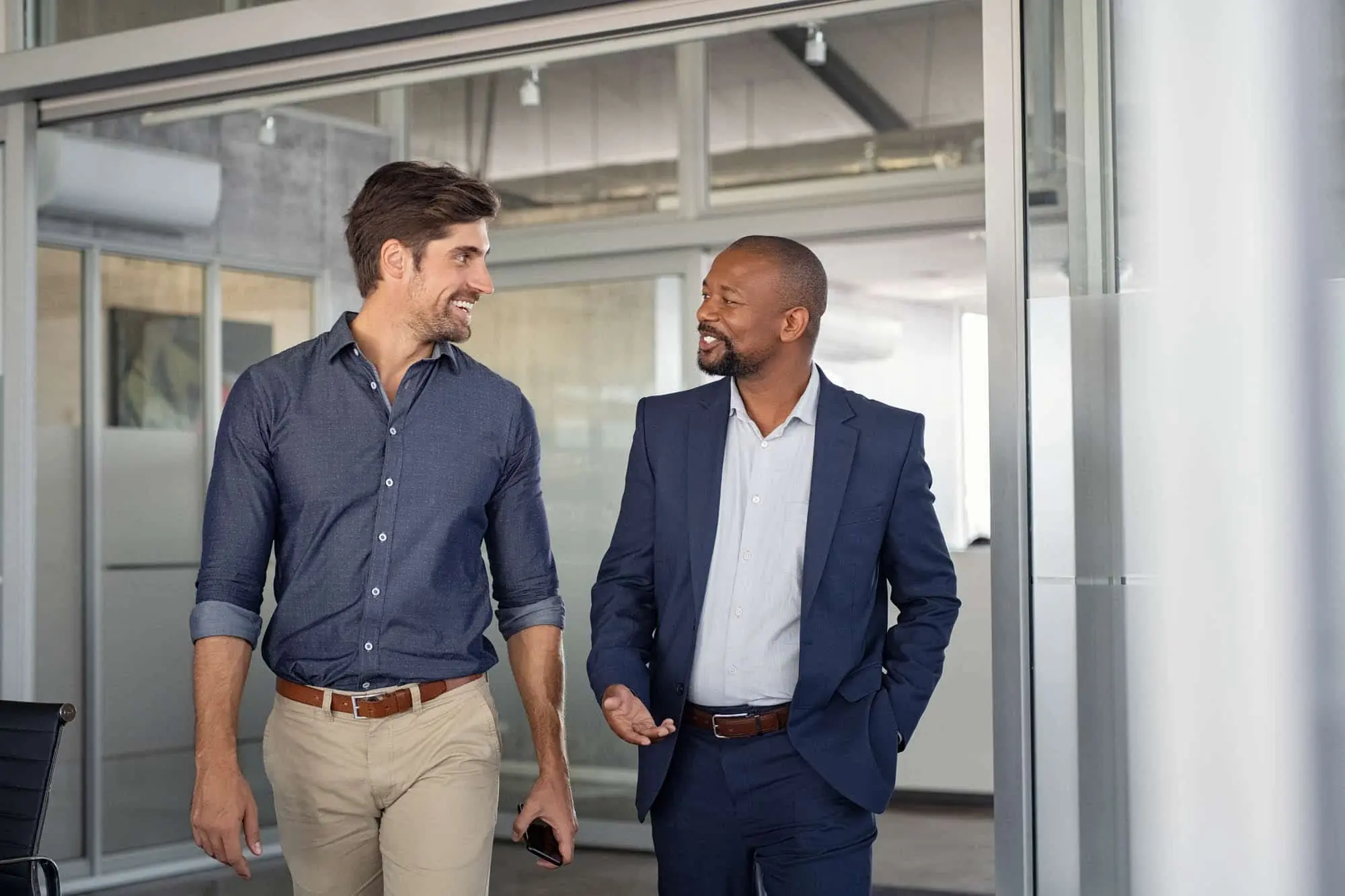 Photo of 2 people walking and talking inside a builiding, Healthtech Resources, Inc. Healthcare IT, Phoenix, AZ